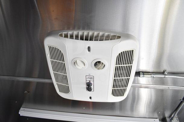 Interior view of a 2021 Cruising Kitchens food trailer with a vent system installed, showcasing clean, modern design.
