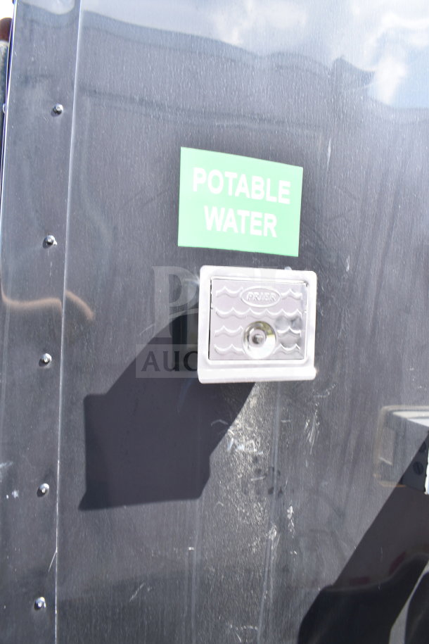 2021 Cruising Kitchens food trailer with "Potable Water" label and Prier access panel visible.