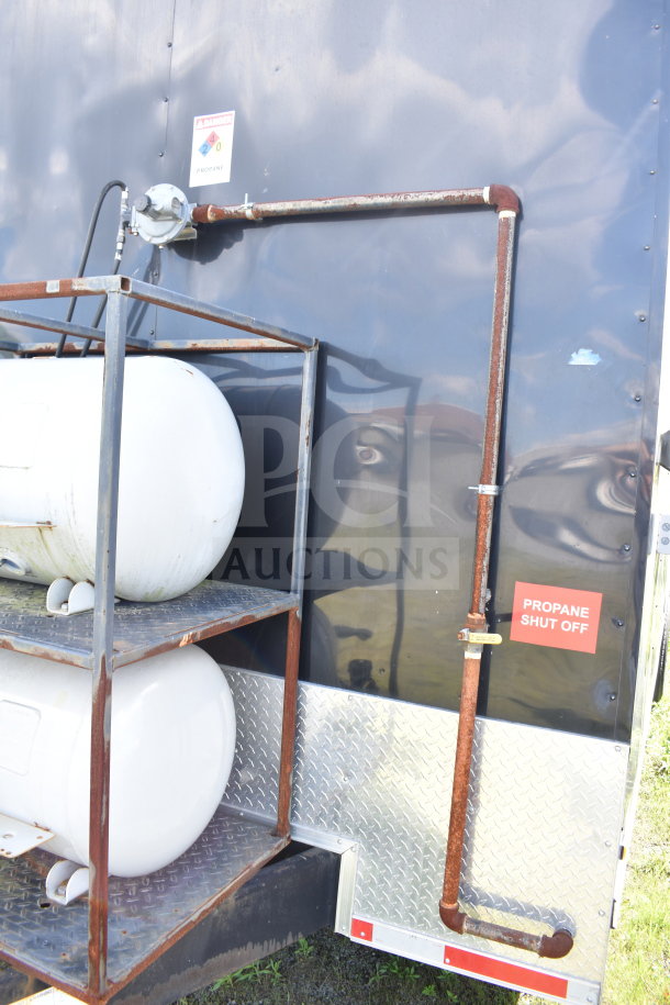 2021 Cruising Kitchens 8.5'x24' food trailer exterior with propane tanks, shut-off valve, and visible warning signs.