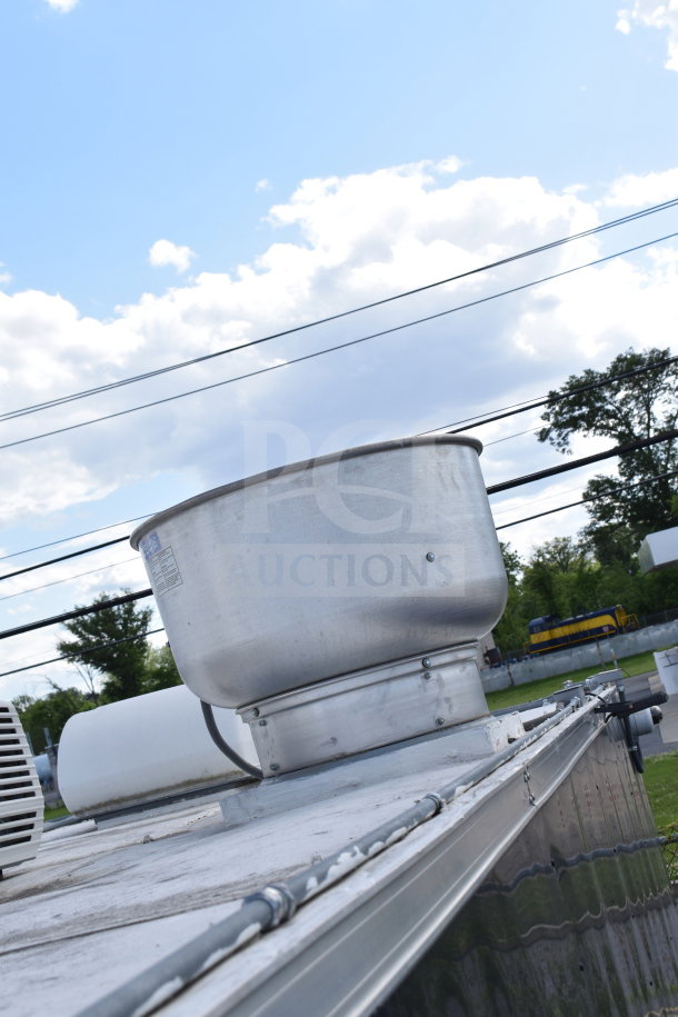 Exterior view of a 2021 Cruising Kitchens food trailer featuring a CaptiveAire grease hood on the roof.