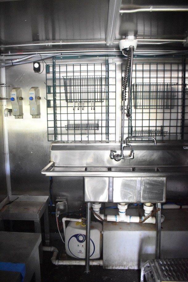 2020 Diamond Cargo 8.5'x24' food trailer interior with stainless steel sink, storage racks, and plumbing visible.