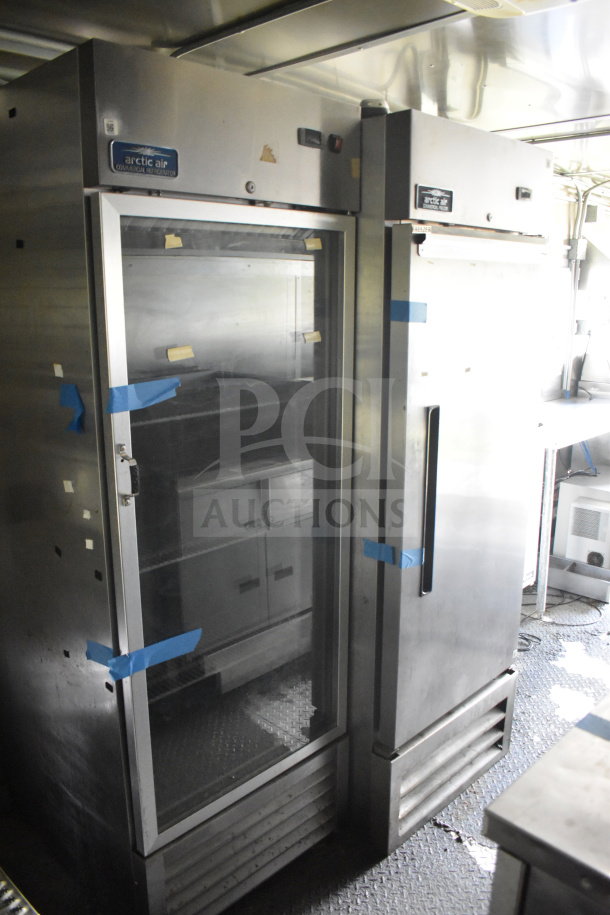 2020 Diamond Cargo 8.5'x24' food trailer interior with stainless steel Arctic Air refrigerators, commercial kitchen setup.