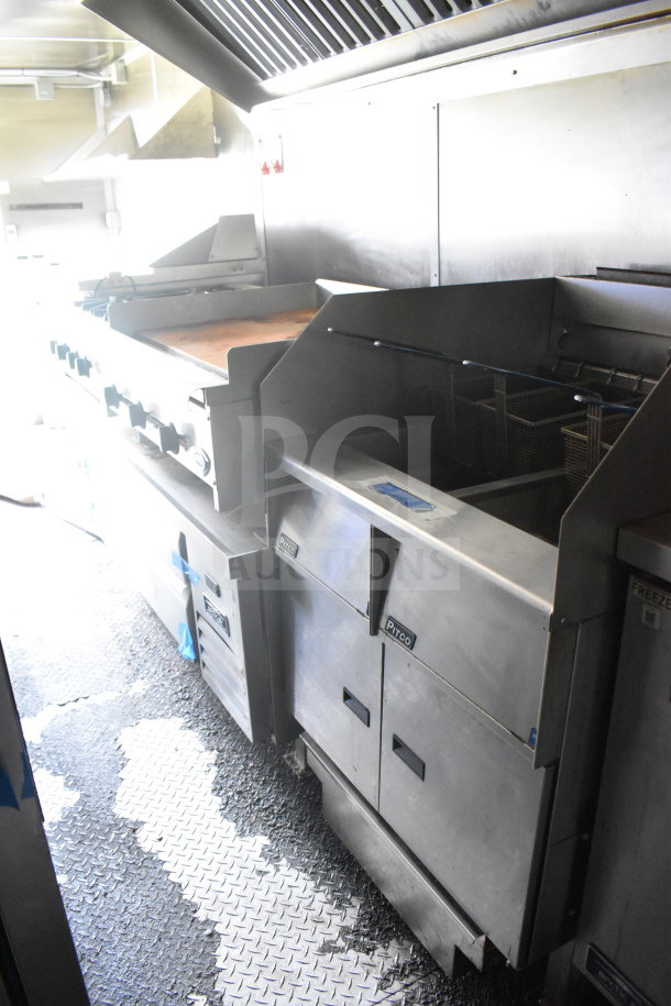 2020 Diamond Cargo 8.5'x24' food trailer interior with cooking equipment. Stainless steel appliances visible.