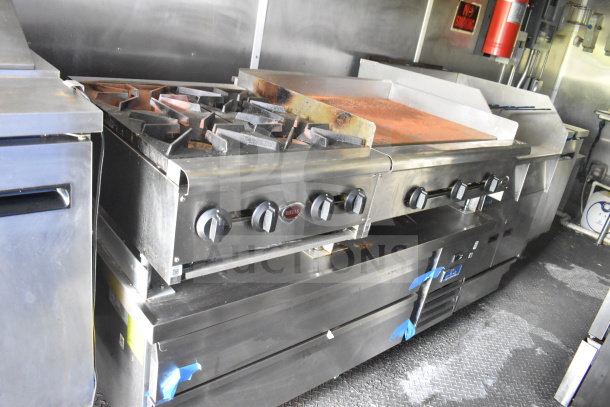 2020 Diamond Cargo 8.5'x24' food trailer interior, featuring commercial stovetop, oven, and griddle in good condition.