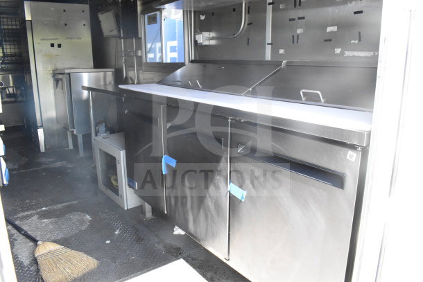 2020 Diamond Cargo 8.5'x24' food trailer interior showing prep counters, stainless steel appliances, and storage.