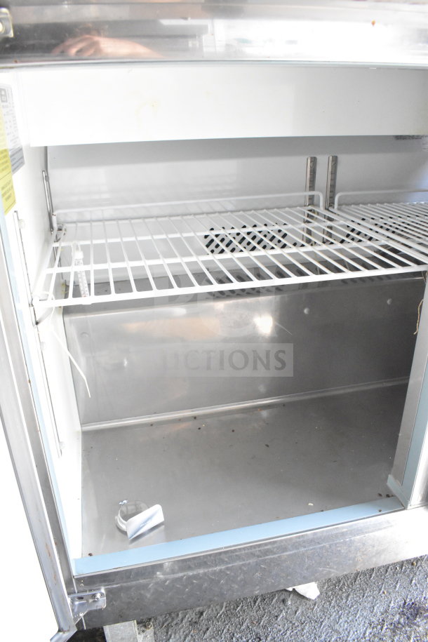 2020 Diamond Cargo 8.5'x24' Food Trailer interior view with stainless steel shelving and clean surfaces, showcasing storage space.