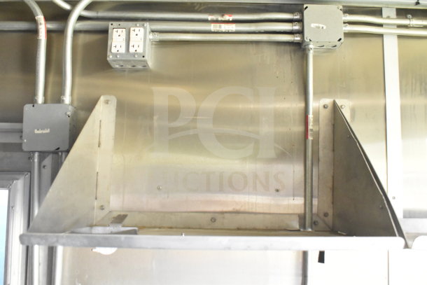 Interior of 2020 Diamond Cargo 8.5'x24' food trailer, showing metal shelves, wiring, and junction boxes.