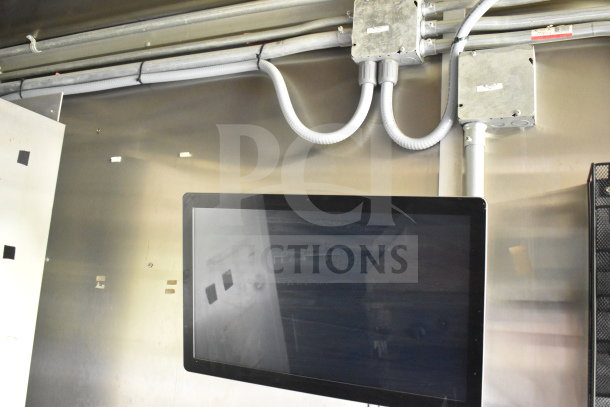 2020 Diamond Cargo 8.5'x24' food trailer interior view, featuring wiring and a mounted screen.