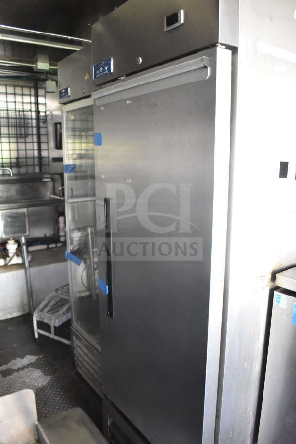 2020 Diamond Cargo 8.5'x24' food trailer interior. Features commercial refrigeration units, stainless steel finish.