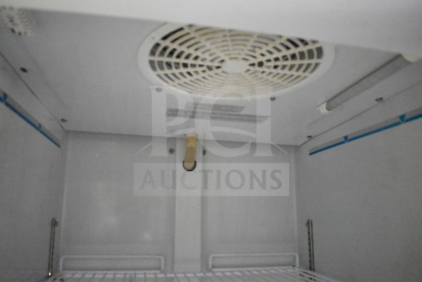 Interior view of a 2020 Diamond Cargo 8.5'x24' food trailer, showcasing cooling fan and shelving.