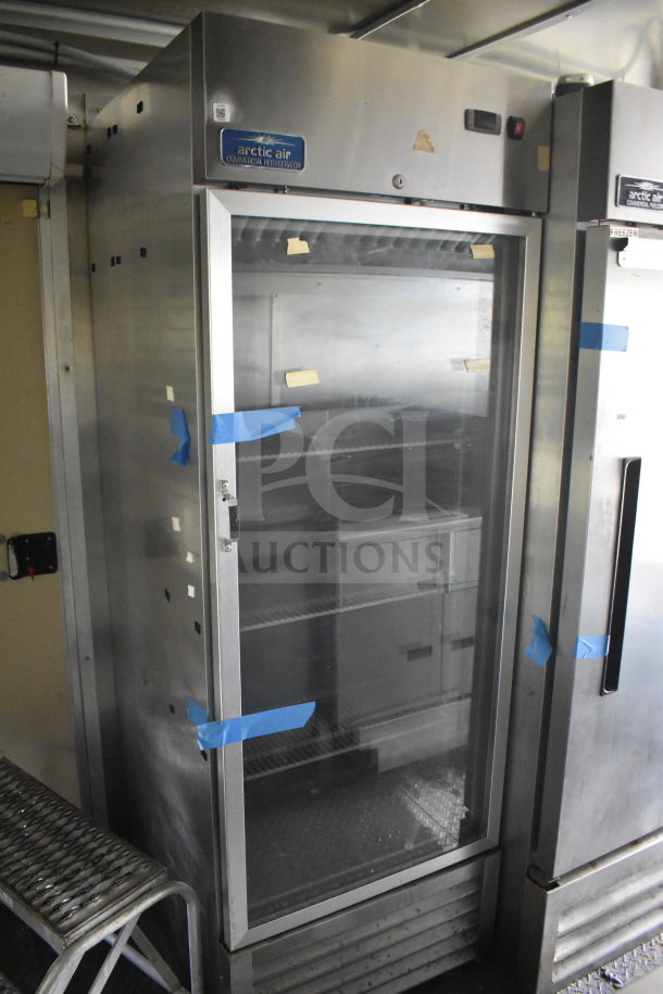 2020 Diamond Cargo 8.5'x24' food trailer interior, featuring an Arctic Air commercial refrigerator; sealed with tape.