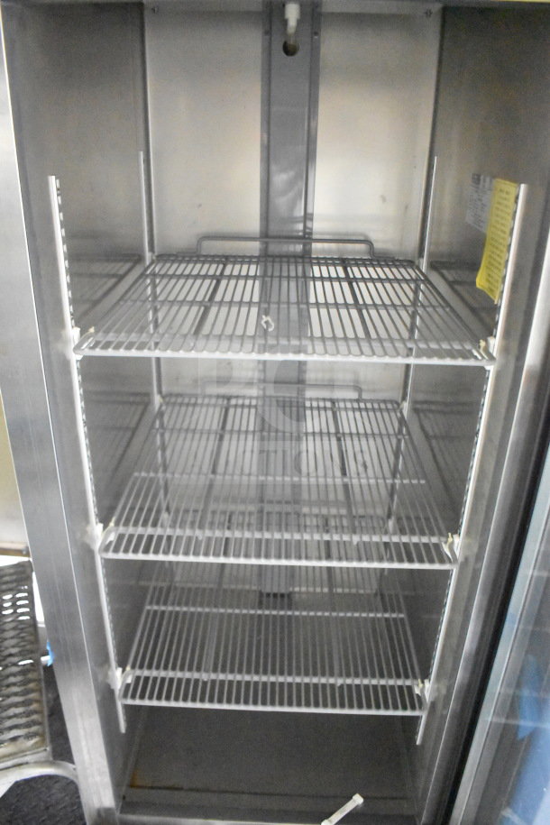 2020 Diamond Cargo 8.5'x24' food trailer interior, featuring stainless steel shelving. Clean and well-maintained.