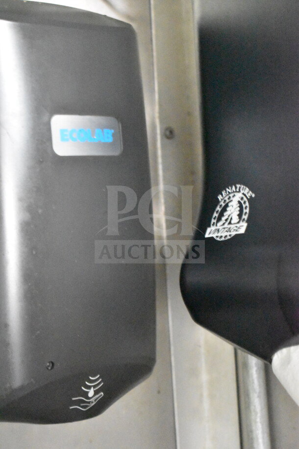 Ecolab soap dispenser and Renature paper towel holder inside a 2020 Diamond Cargo food trailer.