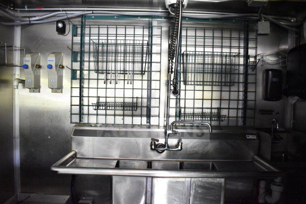 2020 Diamond Cargo 8.5'x24' food trailer kitchen interior with stainless steel sink, wire racks, and soap dispensers.