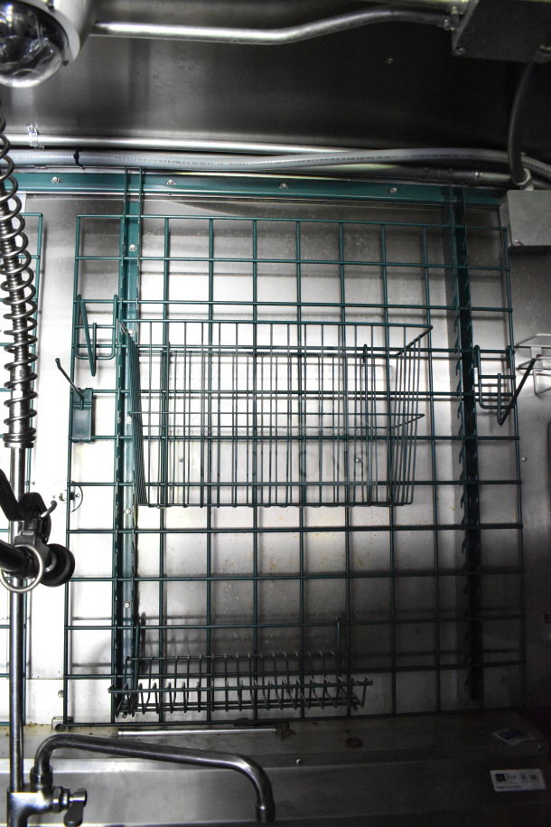 Interior of a 2020 Diamond Cargo 8.5'x24' food trailer featuring metal racks and wiring. Clean condition, suitable for food service.