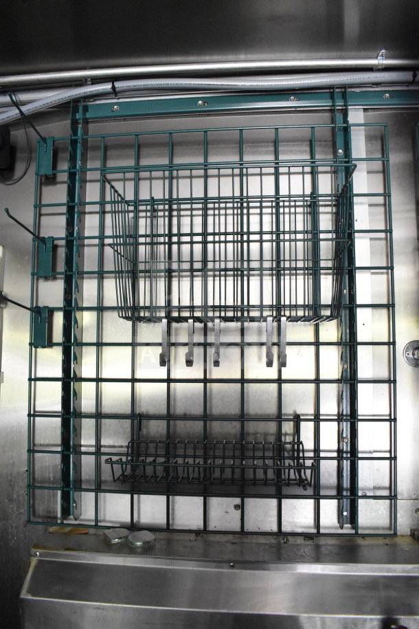 Interior of a 2020 Diamond Cargo 8.5'x24' food trailer showing metal shelving and storage racks in good condition.