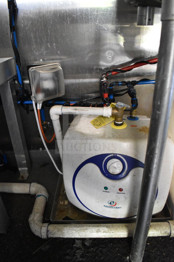 Under-sink water heater in 2020 Diamond Cargo 8.5'x24' food trailer, showing pipes and wiring, brand Eccotemp.