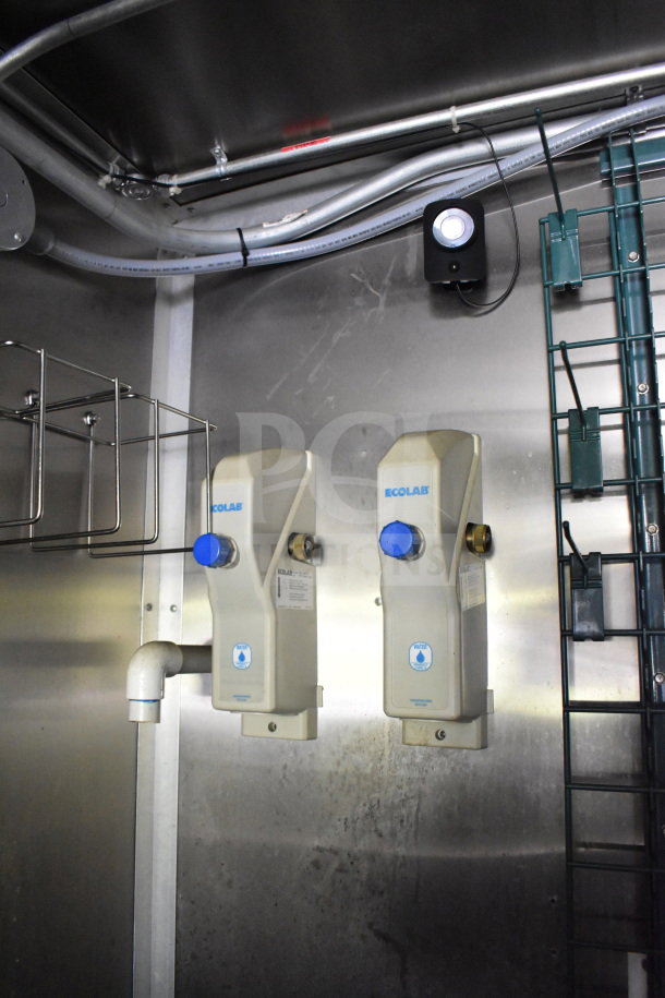 2020 Diamond Cargo food trailer interior with Ecolab dispensers and plumbing. Metal shelving and wiring visible.