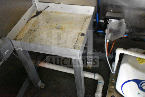 2020 Diamond Cargo 8.5'x24' food trailer interior showing a metal prep table, plumbing, and utility connections, VIN 53NBE2422L1083693.
