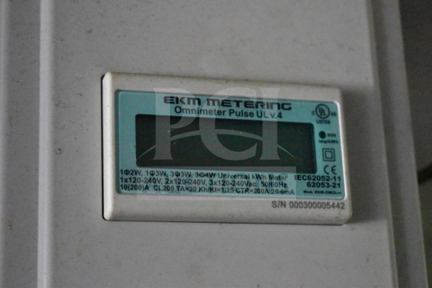 An EKM Metering Omnimeter Pulse UL v.4 on a 2020 Diamond Cargo food trailer, showing specifications and serial number.
