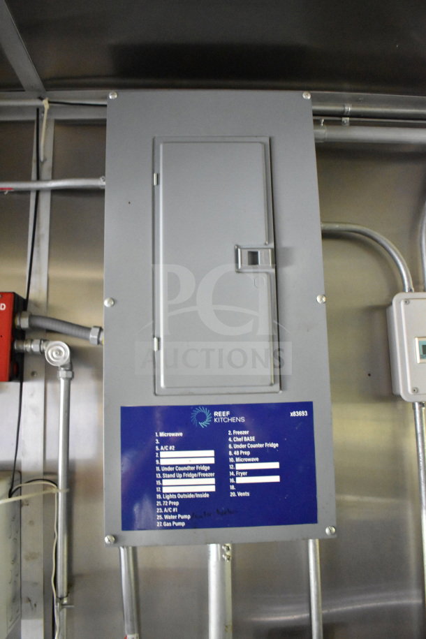 Electrical panel inside 2020 Diamond Cargo 8.5'x24' Food Trailer, labelled for appliances and circuits. Serial: x83693.