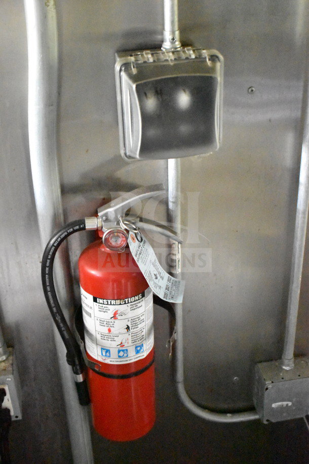 2020 Diamond Cargo 8.5'x24' food trailer interior with mounted fire extinguisher. Visible instructions and tagging.
