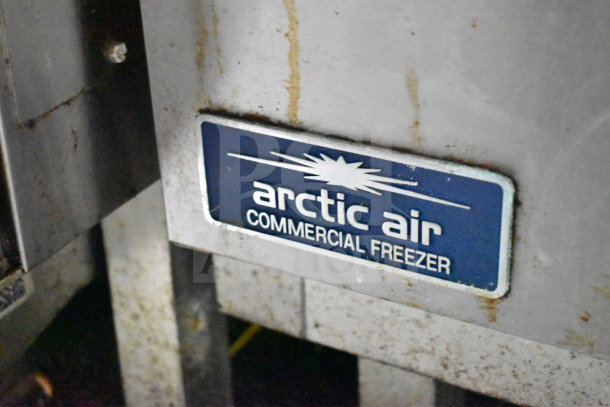 Arctic Air commercial freezer label on a 2020 Diamond Cargo 8.5'x24' food trailer, showing signs of wear.