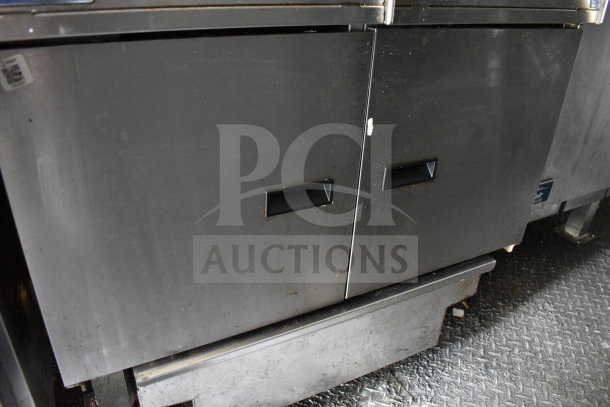 2020 Diamond Cargo 8.5'x24' food trailer interior with dual black metal storage compartments, showing mild surface wear.