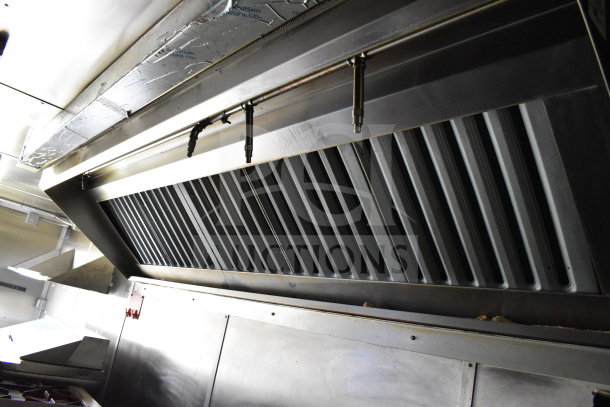 Interior view of 2020 Diamond Cargo 8.5'x24' food trailer, stainless steel commercial vent hood system, excellent condition.