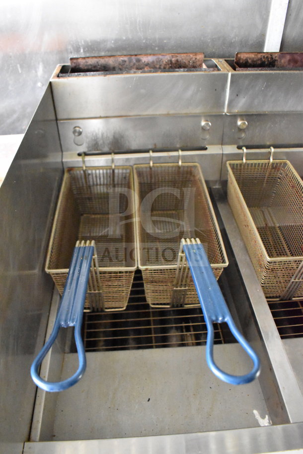 2020 Diamond Cargo food trailer with dual deep fryer baskets, stainless steel interior, blue handles, good condition.