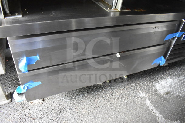 Alt text: 2020 Diamond Cargo 8.5'x24' food trailer interior, featuring steel storage with visible tape, showcasing condition and details.