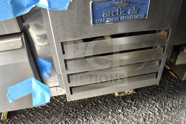 Close-up of Arctic Air commercial refrigerator vent with visible wear, part of a 2020 Diamond Cargo 8.5'x24' food trailer.