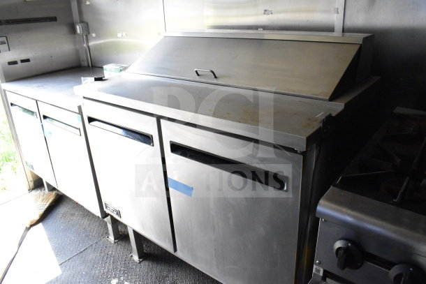 2020 Diamond Cargo 8.5'x24' food trailer interior showing stainless steel counters and storage.