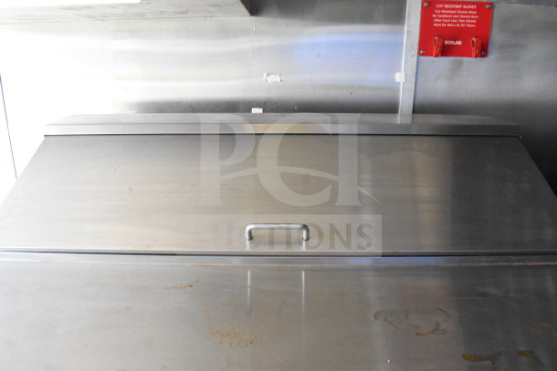 2020 Diamond Cargo 8.5'x24' Food Trailer, stainless steel interior surface, good condition, visible handle, Ecolab glove sign.
