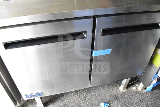 2020 Diamond Cargo 8.5'x24' food trailer interior, featuring stainless steel refrigeration unit, Arctic Air brand, in good condition.