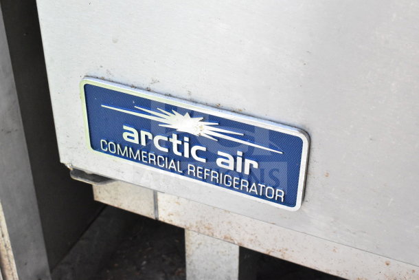Arctic Air Commercial Refrigerator tag on a 2020 Diamond Cargo 8.5'x24' food trailer, emphasizing storage quality.
