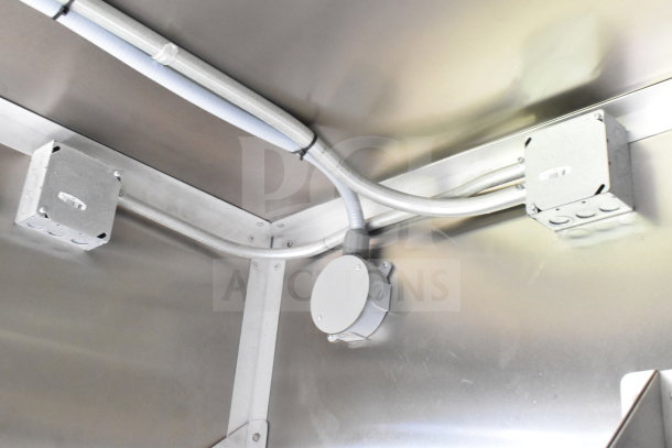 Electrical fixtures inside 2020 Diamond Cargo 8.5'x24' food trailer, showing wiring and junction boxes, in excellent condition.