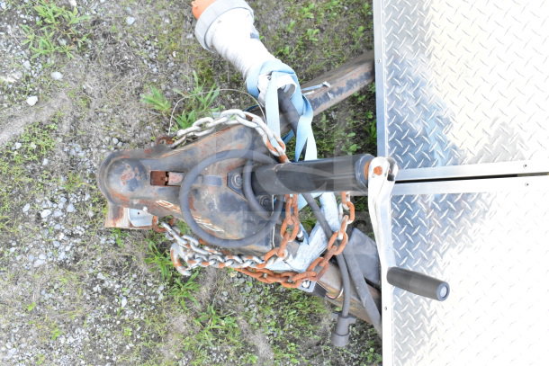 Trailer hitch and chains on a 2020 Diamond Cargo 8.5'x24' food trailer, VIN 53NBE2422L1083693, in fair condition.