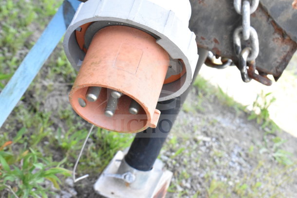 2020 Diamond Cargo 8.5'x24' food trailer power connector, showing a weathered condition.