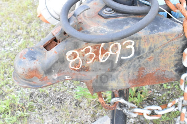 2020 Diamond Cargo 8.5'x24' Food Trailer hitch detail, showing rust and VIN 83693 marking.