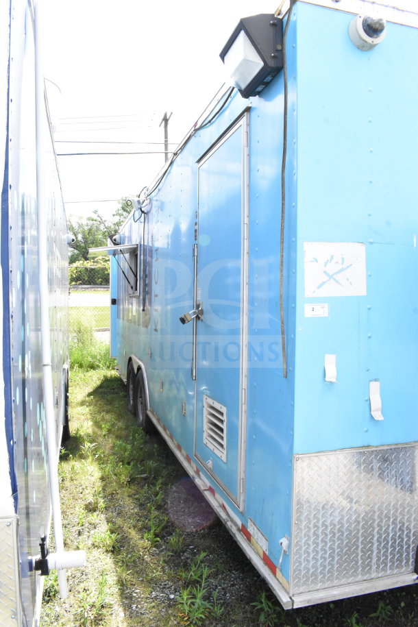 2020 Diamond Cargo 8.5'x24' blue food trailer with grease hood, suppression system, double fryer, range, and refrigeration.