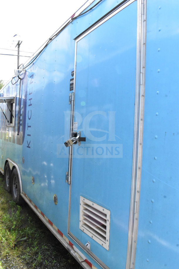 2020 Diamond Cargo 8.5'x24' food trailer in blue, featuring grease hood, suppression system, fryer, range, refrigerator; side view.