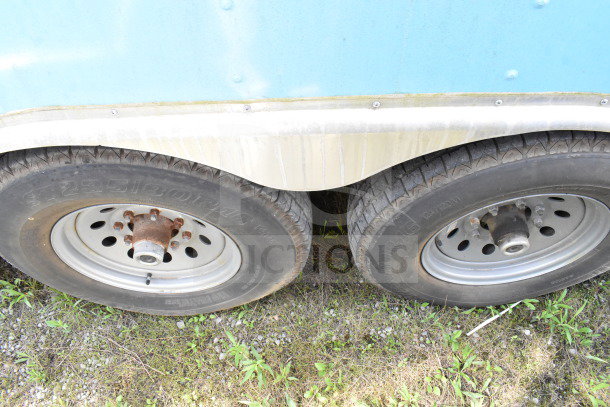 2020 Diamond Cargo 8.5'x24' food trailer tires and exterior; shown are dual tires with visible wear.