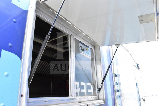 2020 Diamond Cargo 8.5'x24' food trailer with serving window open, grease hood visible; equipped with fryer, range, refrigeration.