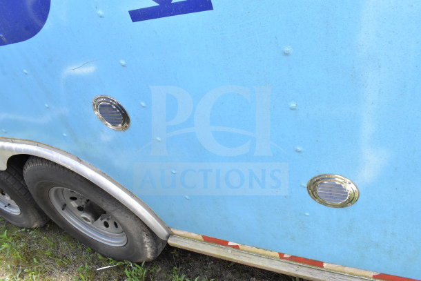 2020 Diamond Cargo 8.5'x24' food trailer; visible side with scratches, wheels, and ventilation grilles.