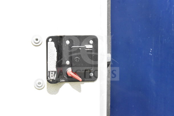 Close-up of grease hood suppression control on a 2020 Diamond Cargo food trailer, showcasing safety features.