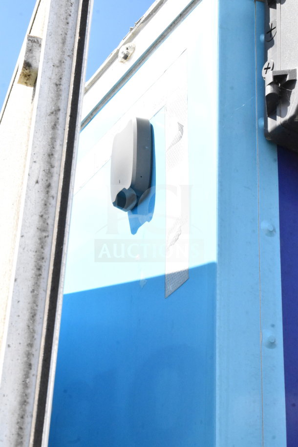 2020 Diamond Cargo 8.5'x24' food trailer exterior corner showing vent feature, blue panels, and structural details.