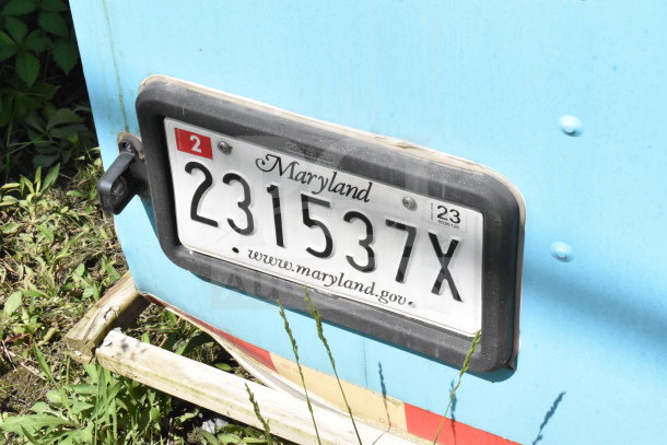 2020 Diamond Cargo 8.5'x24' food trailer, shown with Maryland license plate 231537X, blue exterior, grassy background.