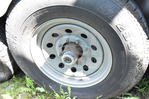 Steel wheel and tire of 2020 Diamond Cargo food trailer, model ST235/80R16, showing tread and safety details.