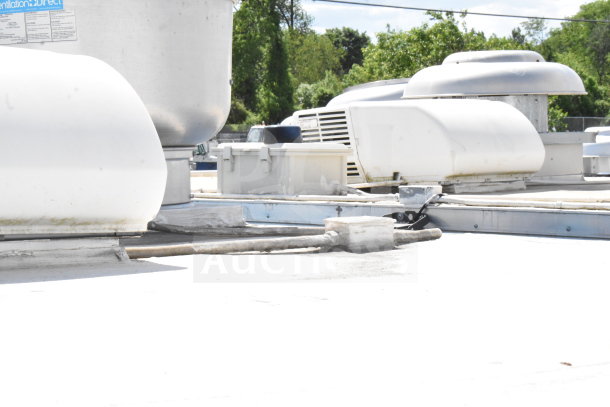 2020 Diamond Cargo 8.5'x24' food trailer roof with ventilation systems, grease hood, and suppression equipment installed.